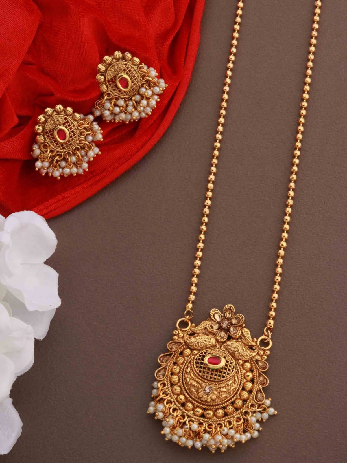 Gold earrings with on sale pendant set