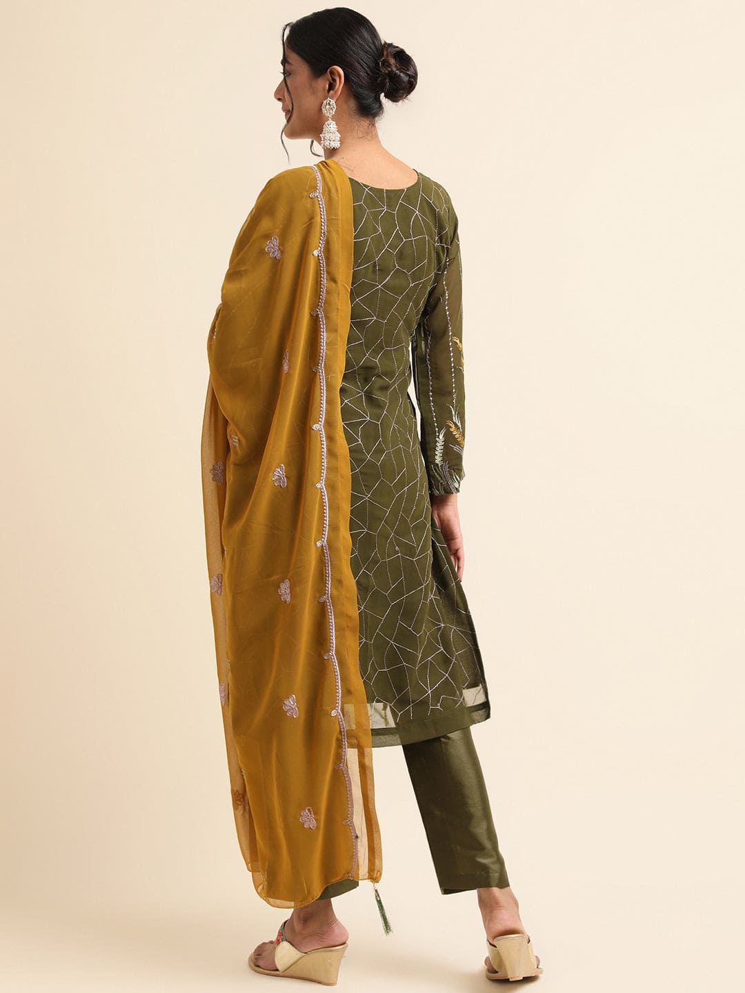 Embrace Elegance with Green Pakistani Suit Design