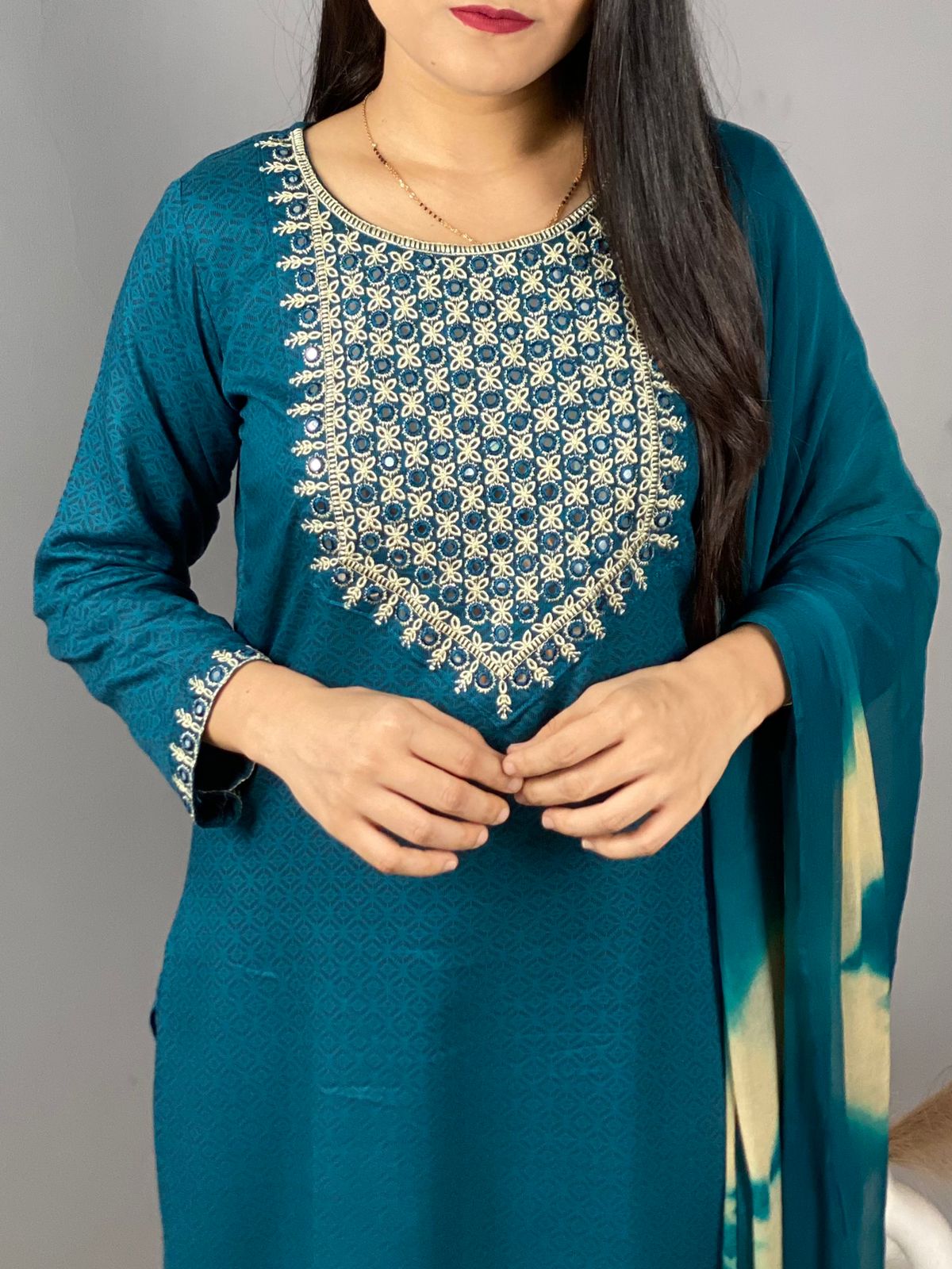 perfect kurti set for daily use with some elegant touch of embroidery.