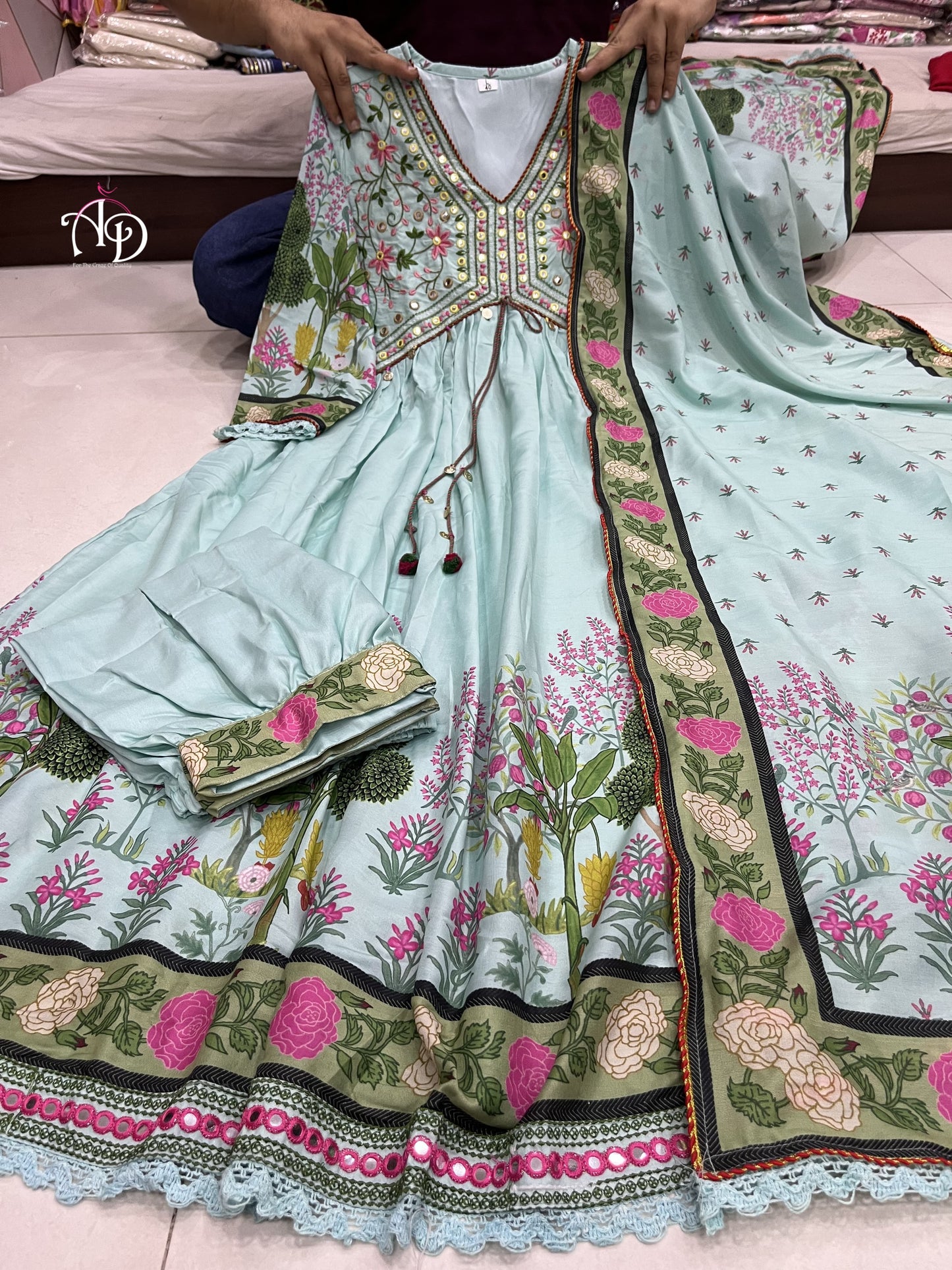 Beautiful Pink Muslin Alia Suit Set which is beautifully decorated with intricate hand embroidery, Zari weaving and digital prints. It is paired with matching pants and lace dupatta.